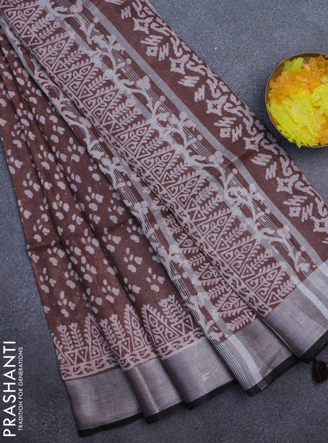 Pure linen saree coffee brown with allover prints and silver zari woven border