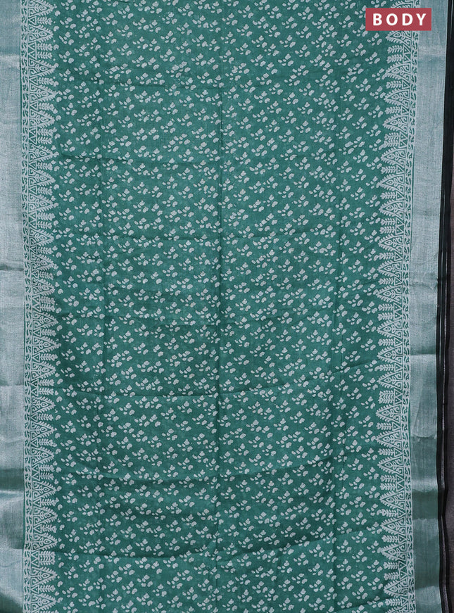 Pure linen saree teal green and black with allover prints and silver zari woven border