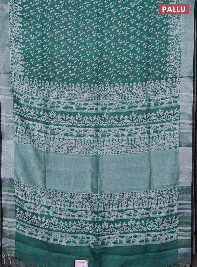Pure linen saree teal green and black with allover prints and silver zari woven border