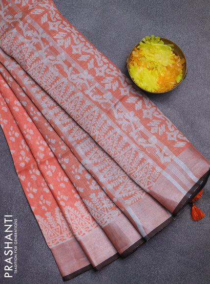 Pure linen saree orange and black with allover prints and silver zari woven border
