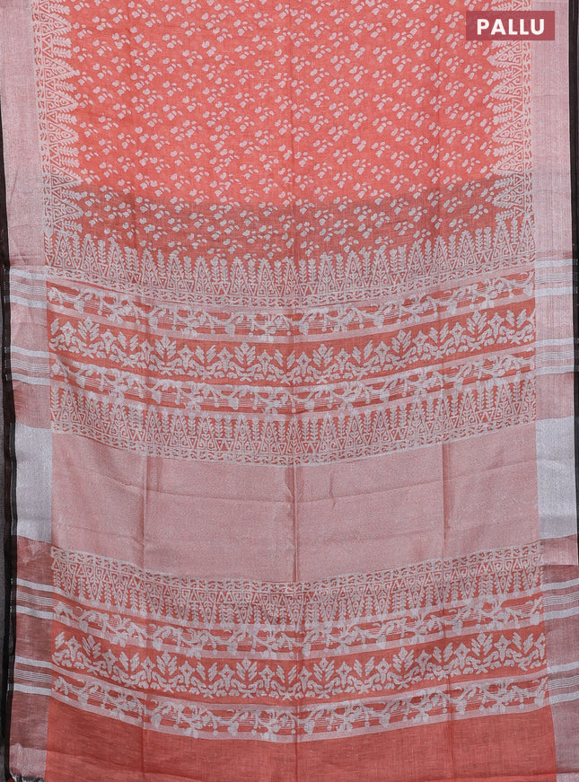 Pure linen saree orange and black with allover prints and silver zari woven border
