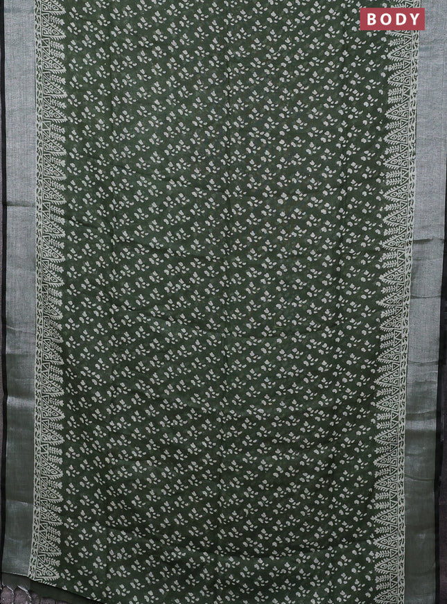 Pure linen saree sap green with allover prints and silver zari woven border