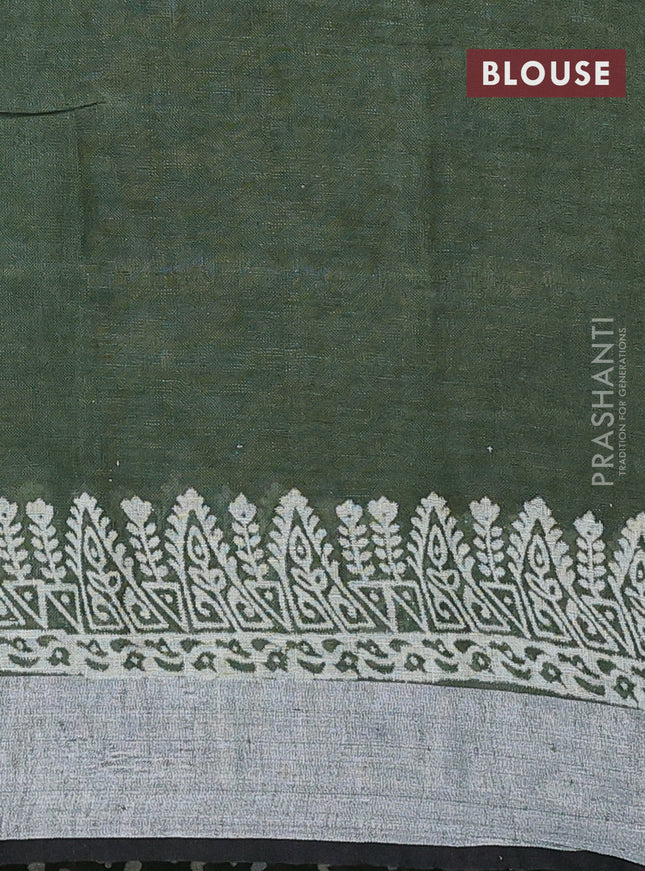 Pure linen saree sap green with allover prints and silver zari woven border