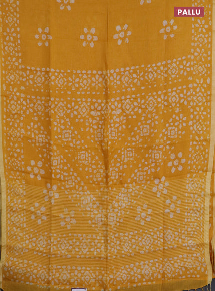 Pure linen saree yellow with batik butta prints and silver zari woven border