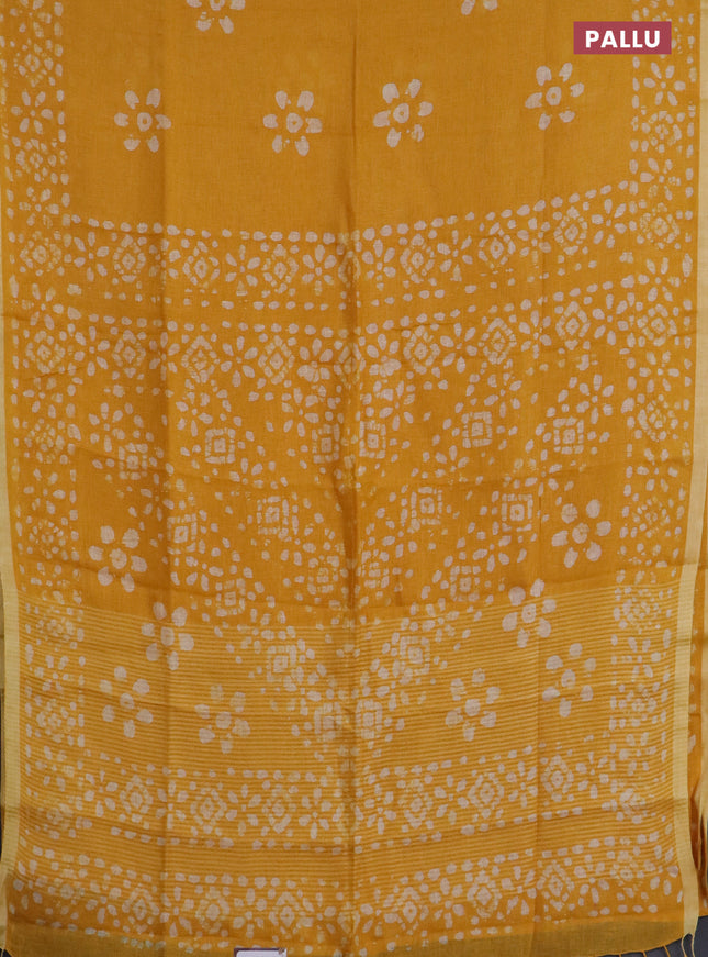 Pure linen saree yellow with batik butta prints and silver zari woven border