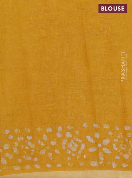 Pure linen saree yellow with batik butta prints and silver zari woven border