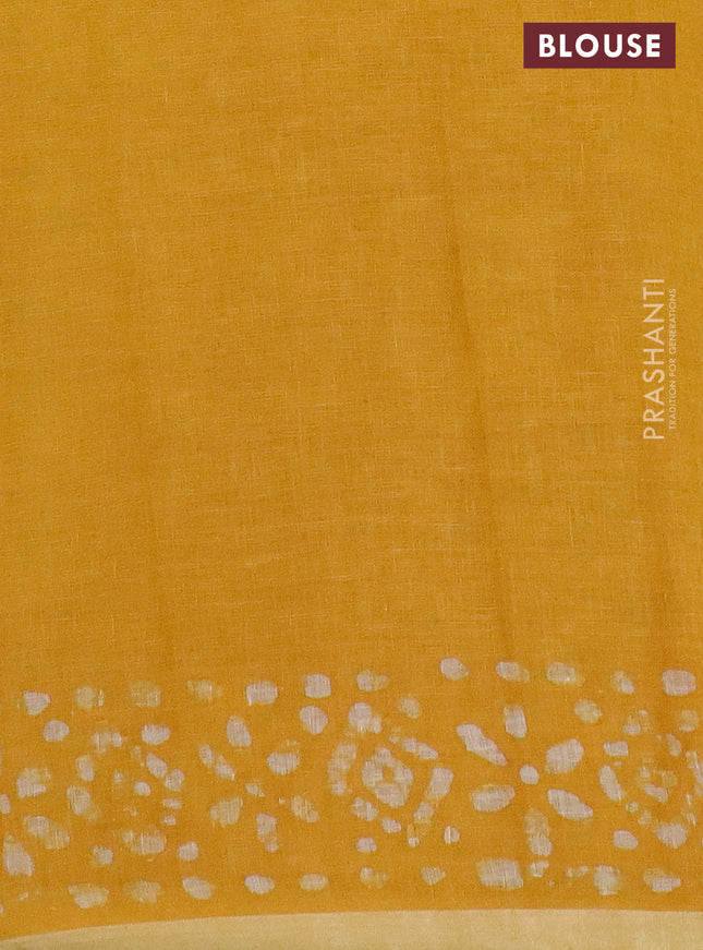 Pure linen saree yellow with batik butta prints and silver zari woven border