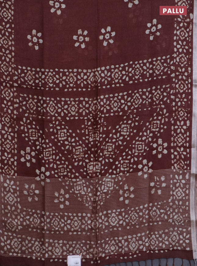 Pure linen saree brown with batik butta prints and silver zari woven border