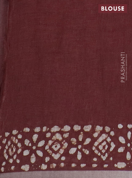 Pure linen saree brown with batik butta prints and silver zari woven border