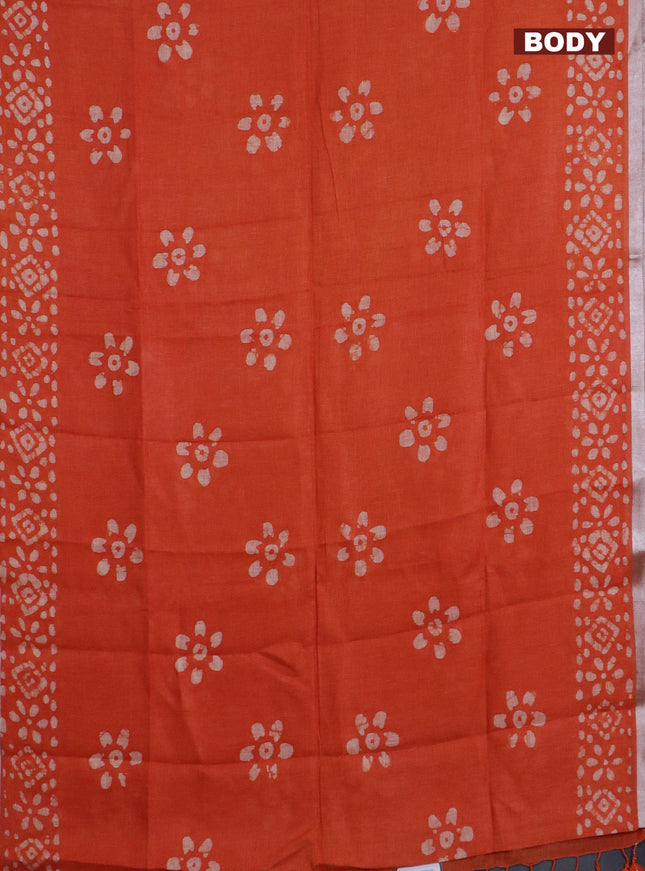 Pure linen saree orange with batik butta prints and silver zari woven border