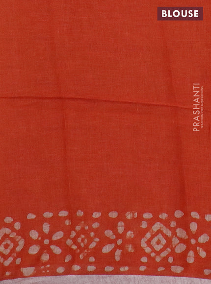 Pure linen saree orange with batik butta prints and silver zari woven border
