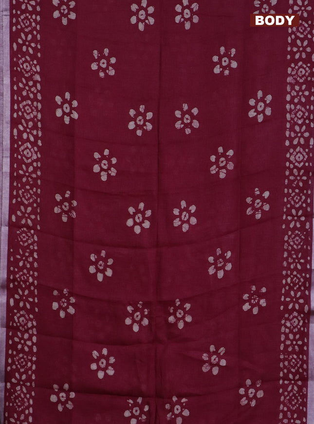 Pure linen saree deep maroon with batik butta prints and silver zari woven border