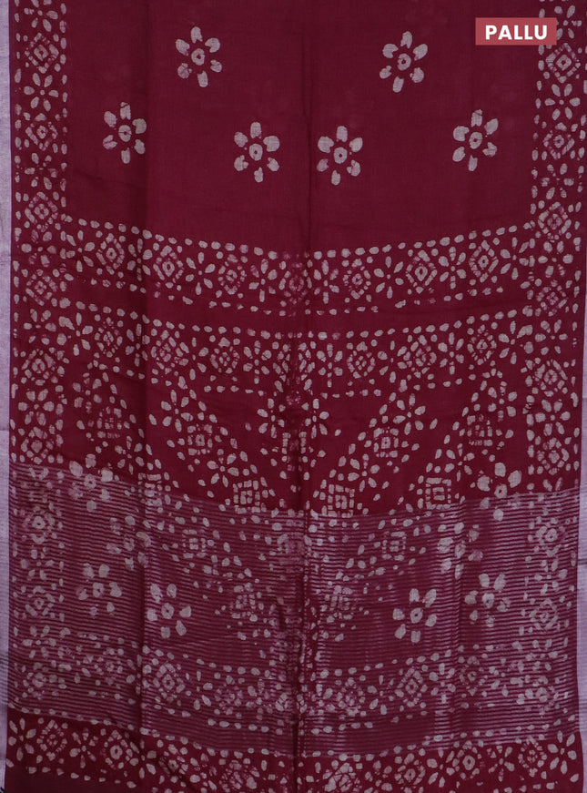 Pure linen saree deep maroon with batik butta prints and silver zari woven border