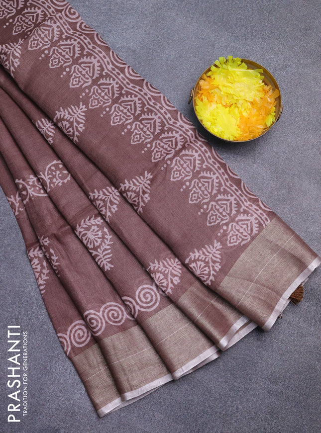 Pure linen saree brown with butta prints and silver zari woven border