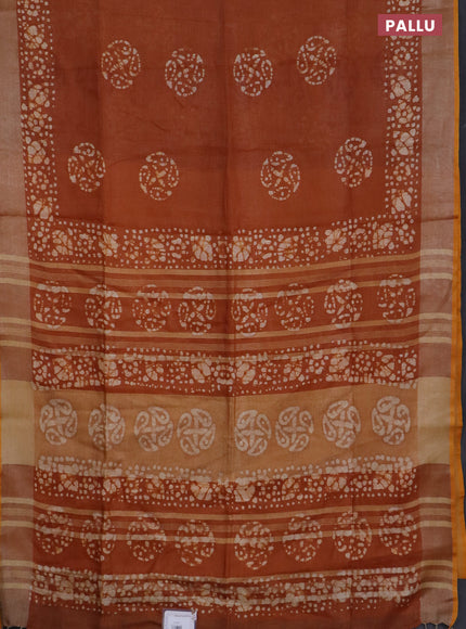 Pure linen saree rust shade with batik butta prints and silver zari woven border