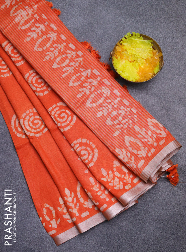 Pure linen saree orange with batik butta prints and silver zari woven border