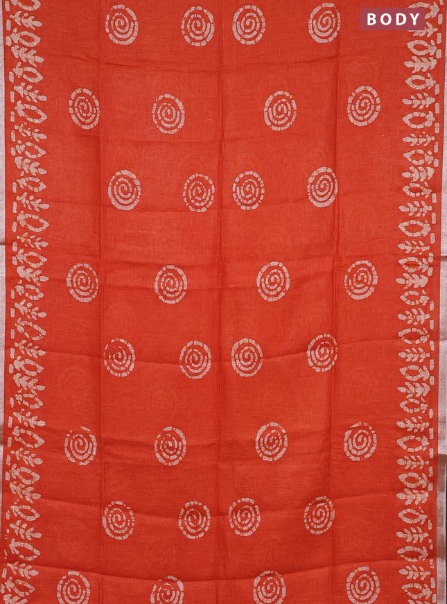 Pure linen saree orange with batik butta prints and silver zari woven border