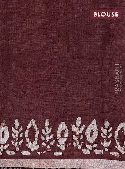 Pure linen saree brown with batik butta prints and silver zari woven border