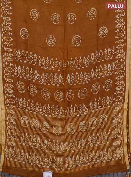 Pure linen saree dark mustard with batik butta prints and silver zari woven border