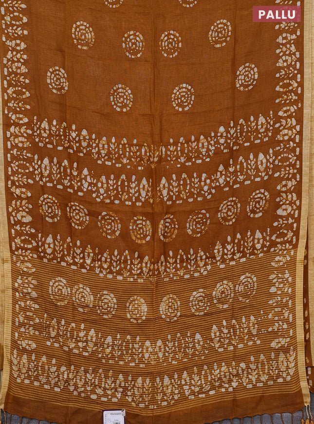 Pure linen saree dark mustard with batik butta prints and silver zari woven border