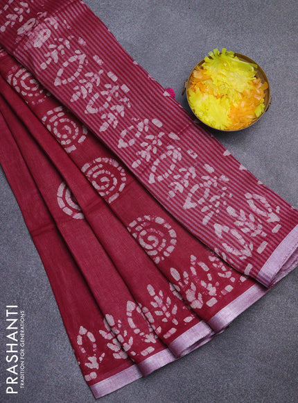 Pure linen saree dark magenta with batik butta prints and silver zari woven border