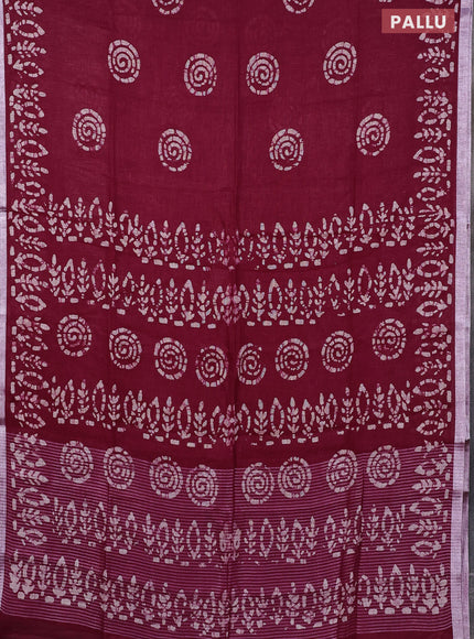 Pure linen saree dark magenta with batik butta prints and silver zari woven border