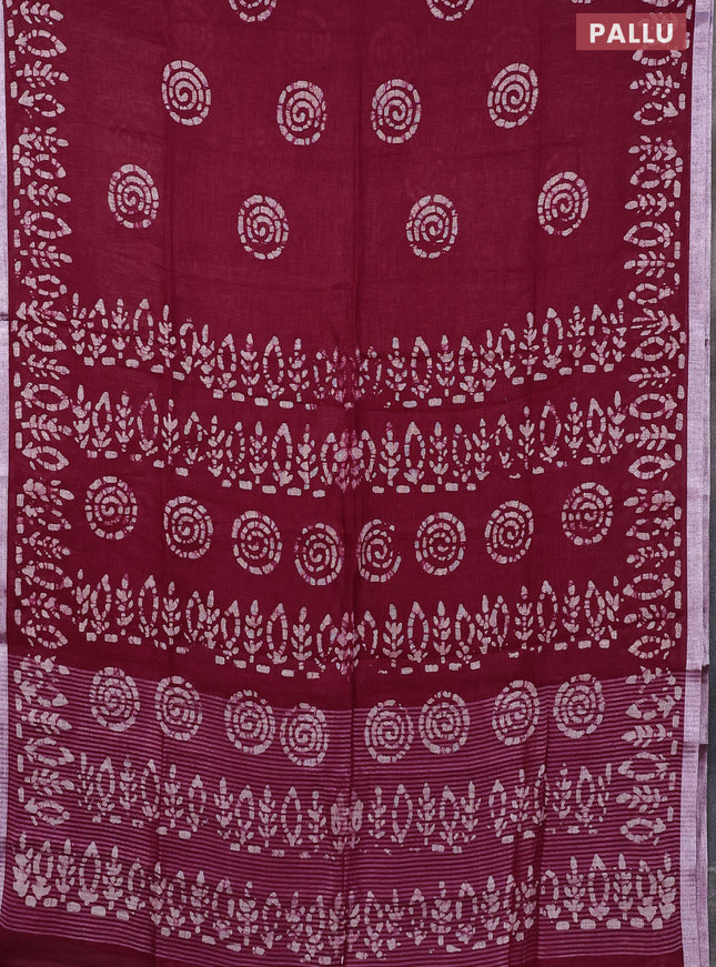 Pure linen saree dark magenta with batik butta prints and silver zari woven border