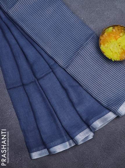 Pure linen saree blue shade with plain body and silver zari woven border