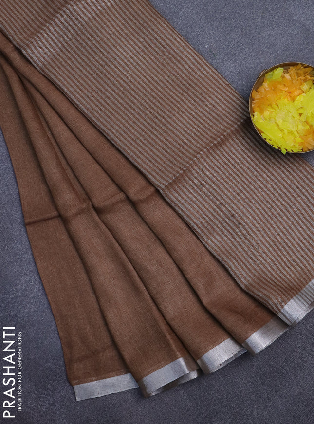 Pure linen saree dark sandal with plain body and silver zari woven border