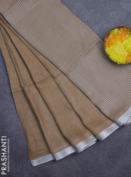 Pure linen saree sandal with plain body and silver zari woven border