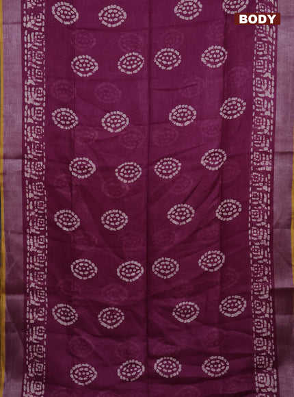 Pure linen saree wine shade with batik prints and silver zari woven border