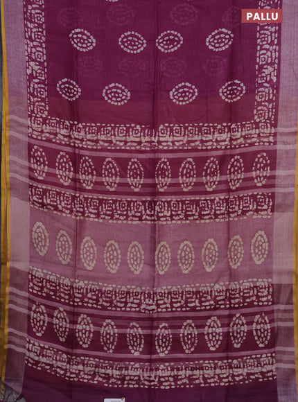 Pure linen saree wine shade with batik prints and silver zari woven border