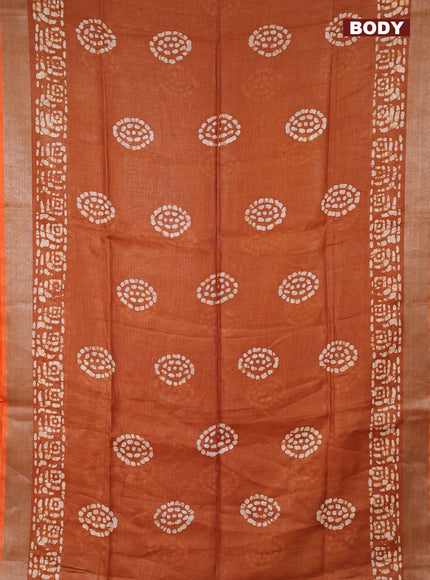 Pure linen saree dark mustard with batik butta prints and silver zari woven border