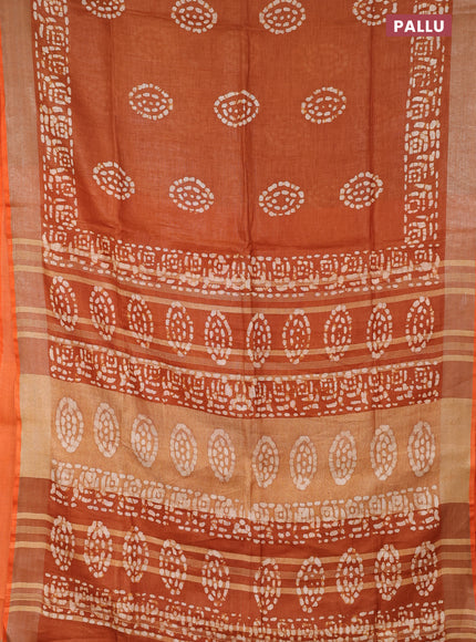 Pure linen saree dark mustard with batik butta prints and silver zari woven border