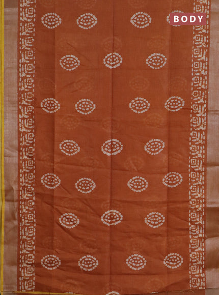 Pure linen saree dark mustard with batik butta prints and silver zari woven border