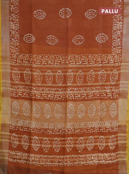 Pure linen saree dark mustard with batik butta prints and silver zari woven border