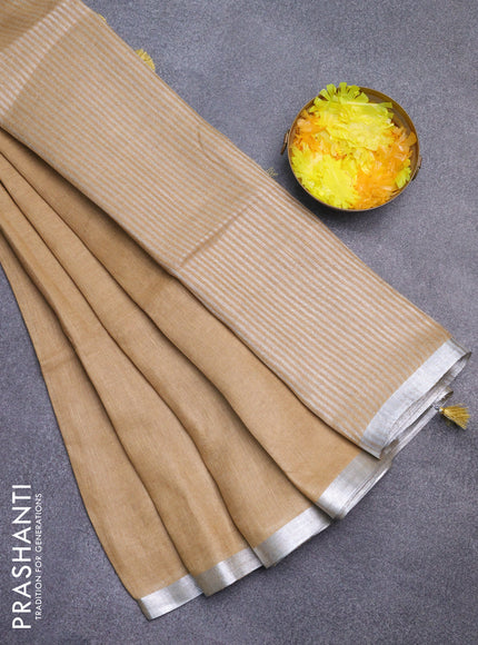 Pure linen saree sandal with plain body and silver zari woven border