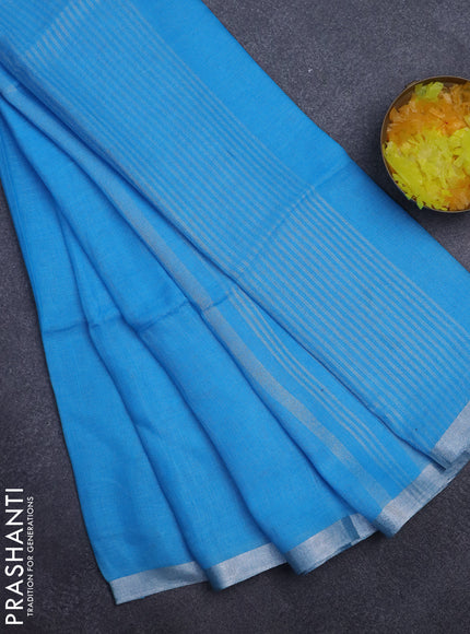 Pure linen saree light blue with plain body and silver zari woven border