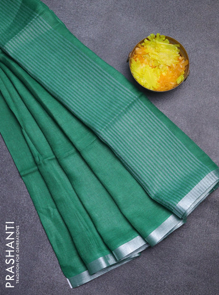 Pure linen saree green with plain body and silver zari woven border
