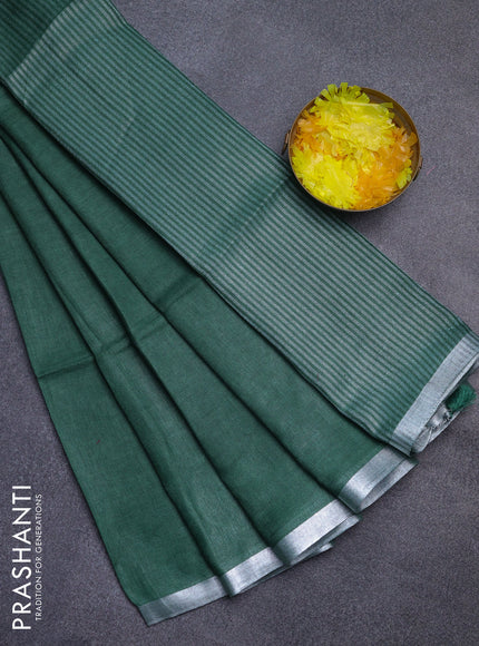 Pure linen saree green with plain body and silver zari woven border