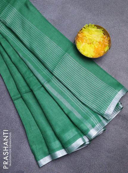 Pure linen saree green with plain body and silver zari woven border