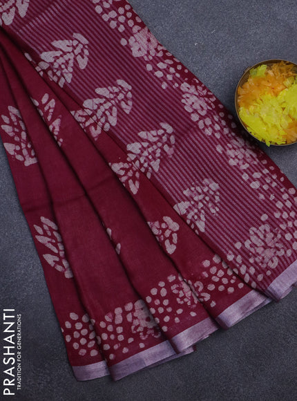 Pure linen saree dark magenta pink with batik butta prints and silver zari woven border