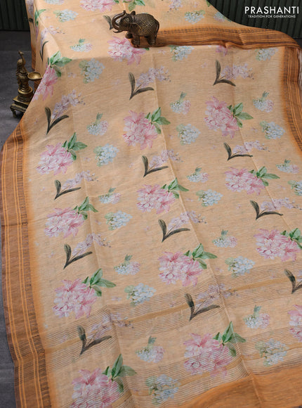 Pure linen silk saree pale orange and orange with allover floral prints and zari woven border