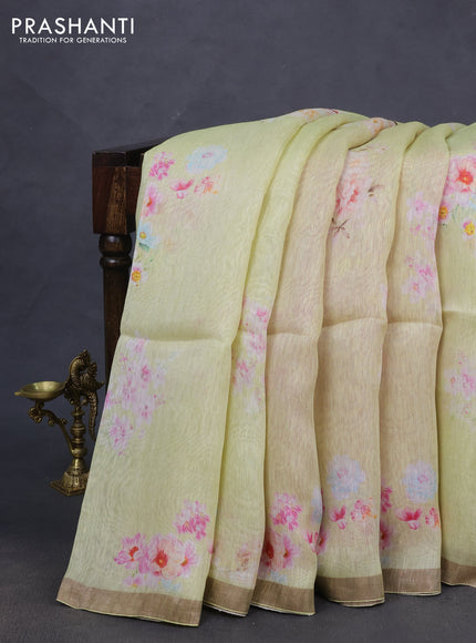 Pure linen silk saree mild pista green and pink shade with floral butta prints and small zari woven border