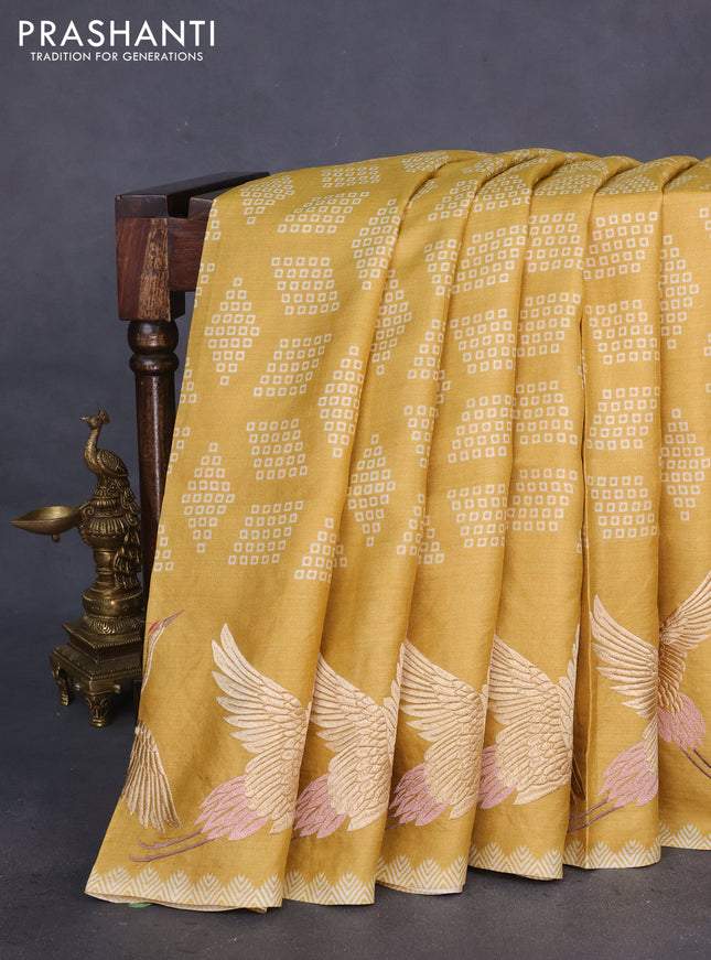 Pure tussar silk saree mustard shade with allover geometric prints and bird design embroidery work border
