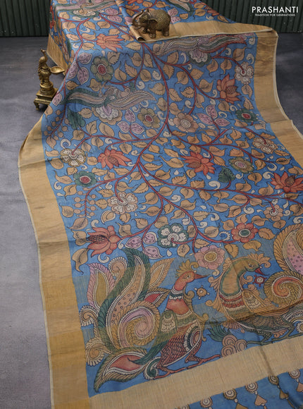 Pure tussar silk saree pastel blue and sandal with allover penkalamkari prints and zari woven border
