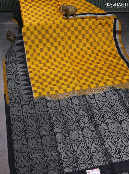 Ikat soft silk saree mustard yellow and black with allover ikat weaves and long silver zari woven border
