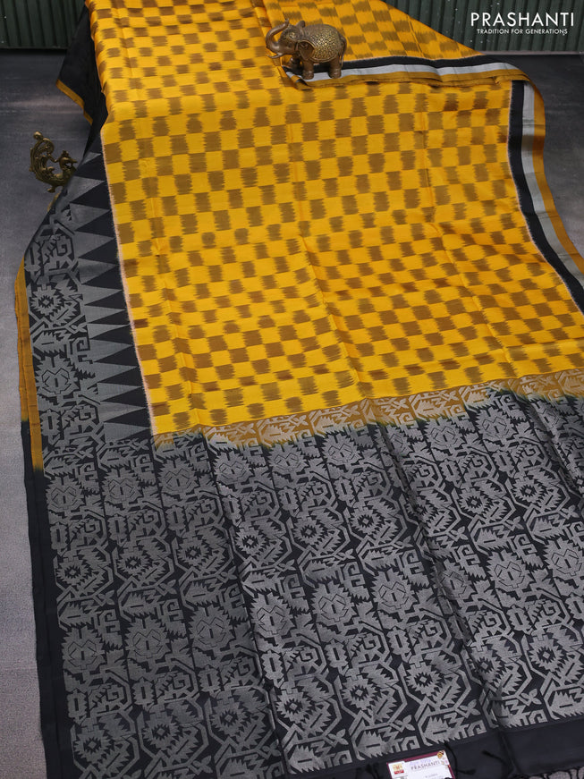 Ikat soft silk saree mustard yellow and black with allover ikat weaves and long silver zari woven border