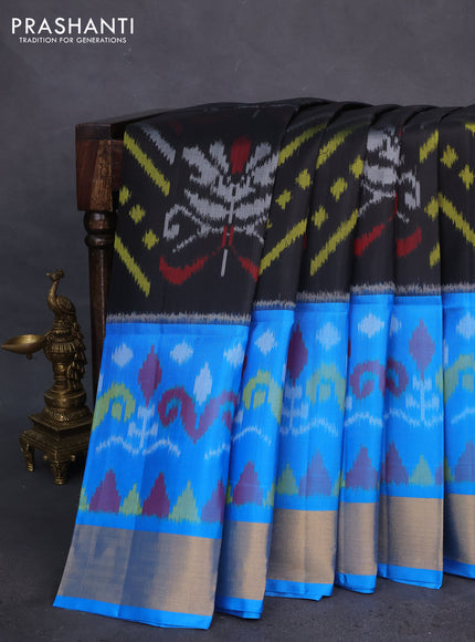 Ikat soft silk saree black and cs blue with allover ikat weaves and zari woven border