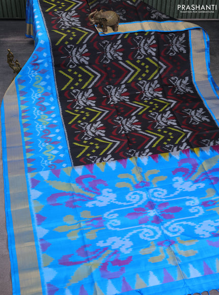 Ikat soft silk saree black and cs blue with allover ikat weaves and zari woven border
